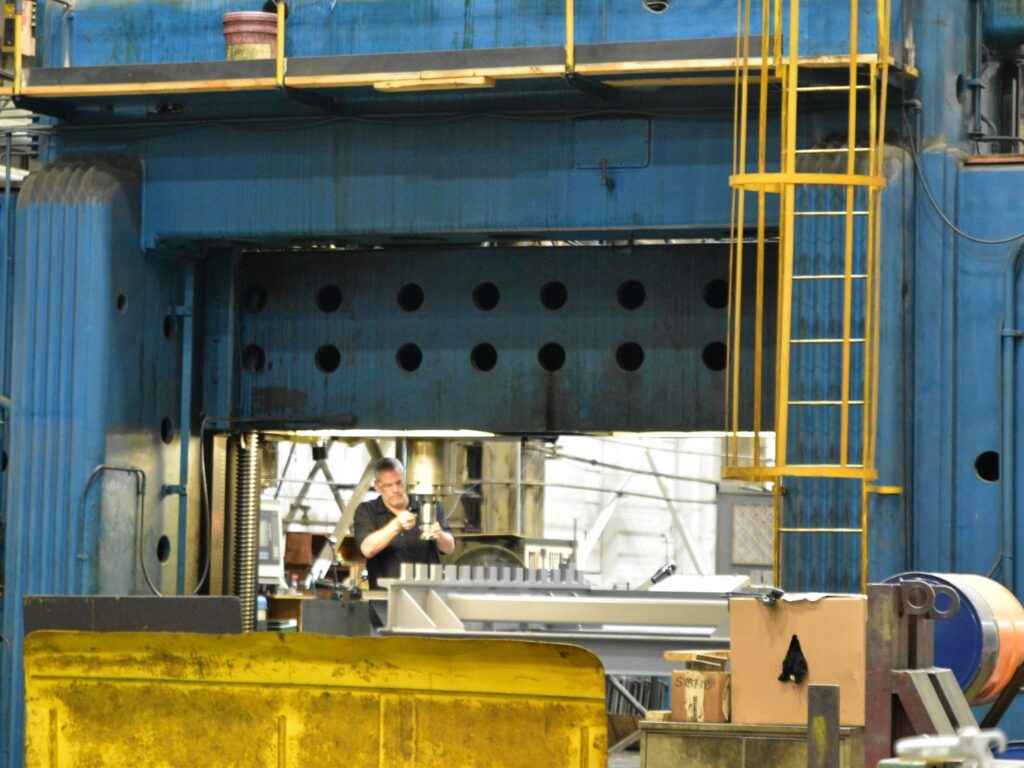 A machinist works at Butech Bliss in Salem.