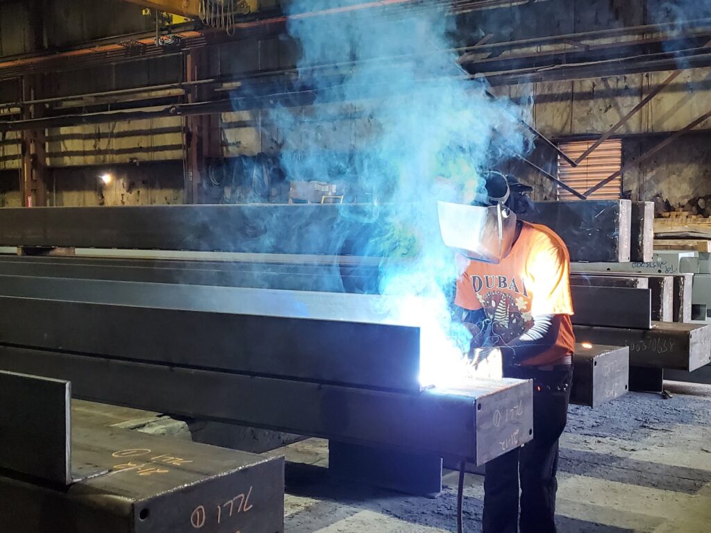 Stacey Gray welds a beam at Livi Steel in Warren.