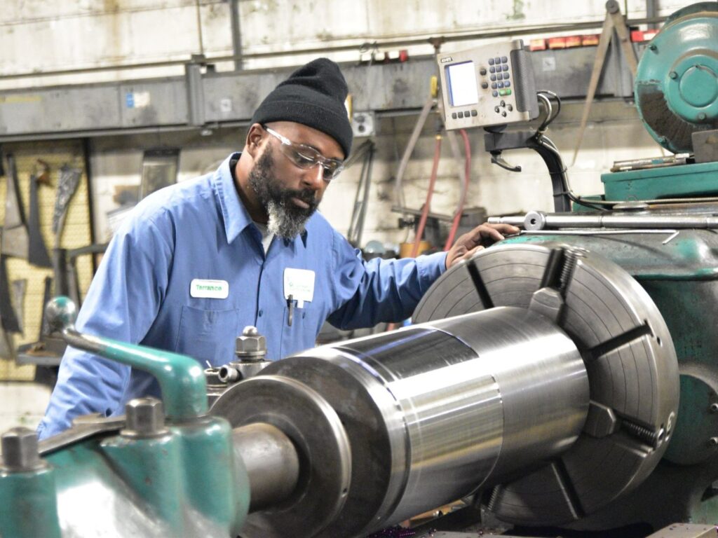 Terrance Jones works at the lathe.