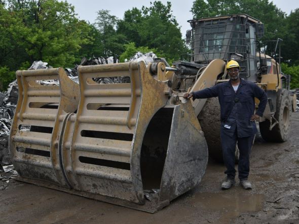 Bernard Jones stands with equipment.